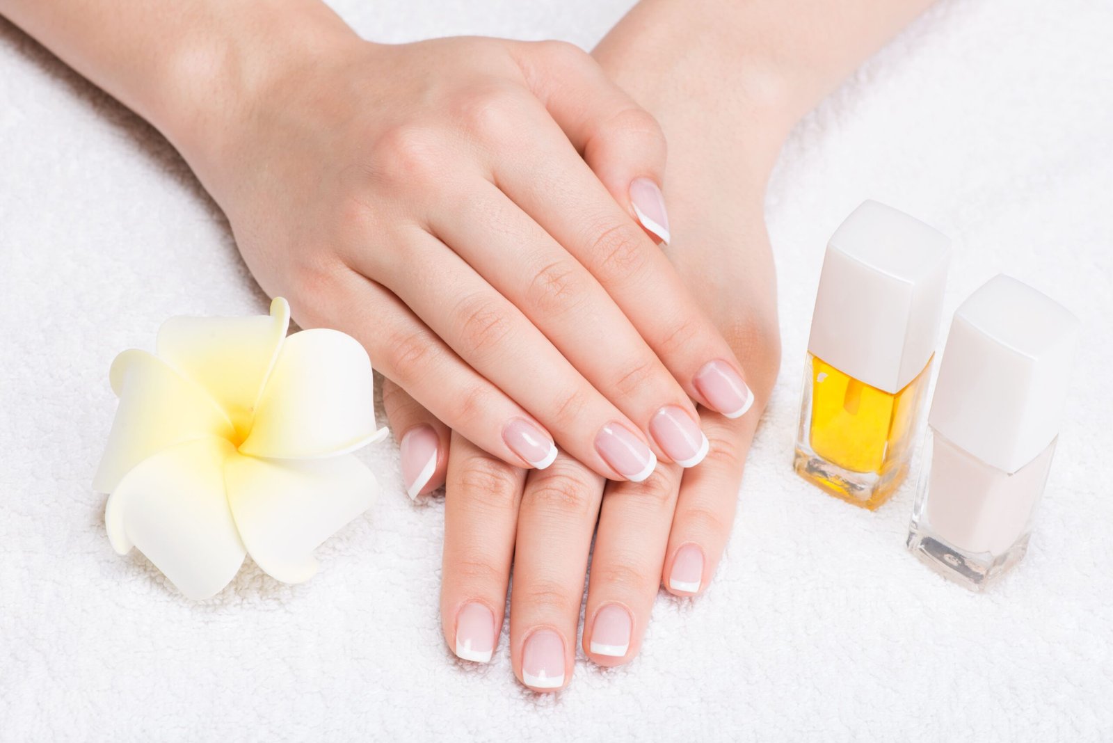 woman-nail-salon-receiving-manicure-by-beautician-beauty-treatment-concept (1)